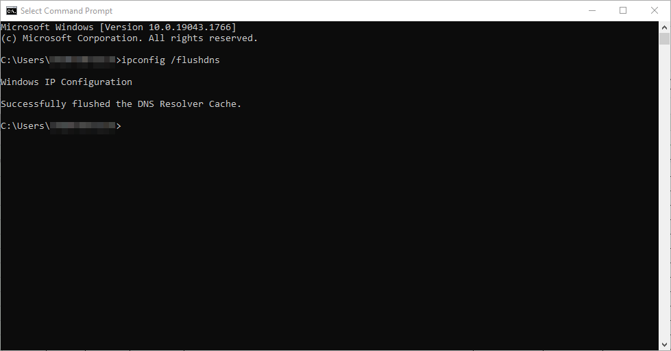 tampilan pesan konfirmasi di command-prompt windows yang menunjukkan bahwa flush dns berhasil